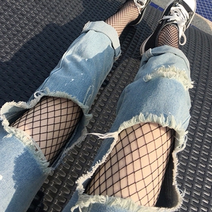 渔网袜破洞牛仔裤图片